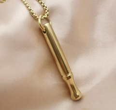 Breathing necklace for anxiety relief featuring a sleek silver pendant on a chain, designed for calming breath exercises.