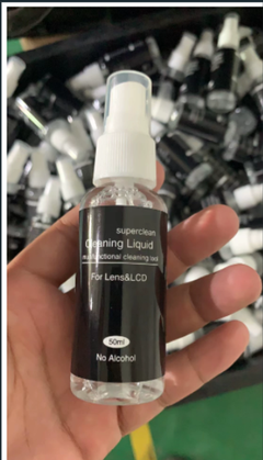 Crystal Clear Lens Cleaner bottle by My Store showing the transparent spray container for cleaning eyeglasses and camera lenses.