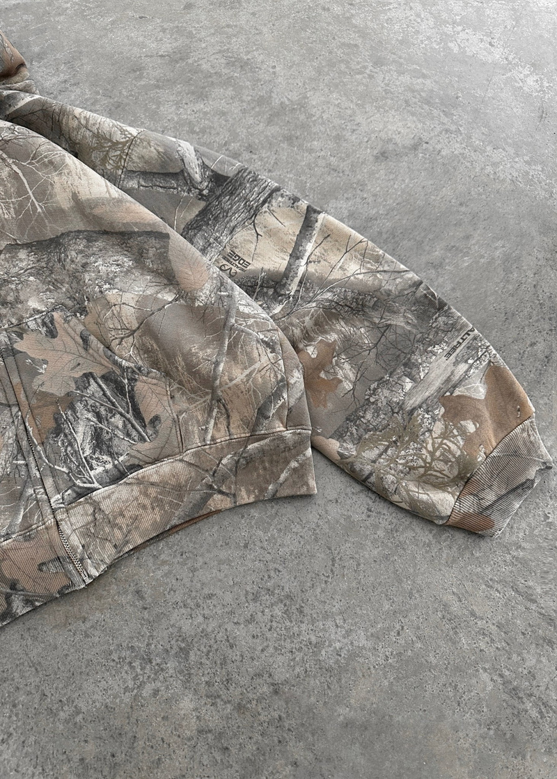 Urban camo retro hoodie with a bold camouflage pattern and relaxed fit, featuring a drawstring hood and ribbed cuffs.