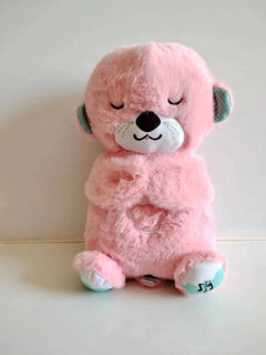 Soft plush otter sound machine toy with sensory features, music, lights, and rhythmic breathing motion for babies.