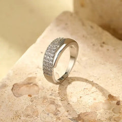 Elegant adjustable sparkle ring with shimmering stones, featuring a sleek band design, perfect for stylish occasions.