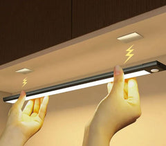 Wireless motion sensor light from My Store with LED bulb and sleek white design, mounted on a wall in a modern home setting.